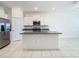 Contemporary kitchen featuring an island, stainless appliances, and ample cabinetry at 31771 Blue Passing Loop, Wesley Chapel, FL 33545