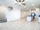 Spacious living room flowing into open kitchen, featuring modern finishes at 31771 Blue Passing Loop, Wesley Chapel, FL 33545