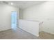 Upstairs loft area features neutral walls and carpet at 31771 Blue Passing Loop, Wesley Chapel, FL 33545