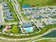 Aerial view of the community featuring a pool, clubhouse, playground, and single Gathering homes at 35100 Brackett Bnd, Zephyrhills, FL 33541