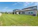 The home has a large lawn and patio that are perfect for outdoor entertaining at 35100 Brackett Bnd, Zephyrhills, FL 33541