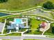 Aerial view of the community pool, splash pad, and covered playground at 35100 Brackett Bnd, Zephyrhills, FL 33541