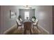 Bright dining area with table and chairs, neutral decor, plants, and natural light at 35100 Brackett Bnd, Zephyrhills, FL 33541