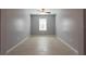 Empty room with tile flooring and a window at 35100 Brackett Bnd, Zephyrhills, FL 33541