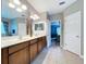 The bathroom features dual sinks, a large mirror, and a doorway to the bedroom at 3544 Brook Crossing Dr, Brandon, FL 33511