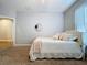 Well-lit bedroom with carpet, bed, mirror, and white trim at 3544 Brook Crossing Dr, Brandon, FL 33511