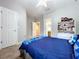 This bedroom features carpet, a ceiling fan, and a view of another room at 3544 Brook Crossing Dr, Brandon, FL 33511