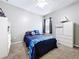 This bedroom features carpet, a ceiling fan, and bright window at 3544 Brook Crossing Dr, Brandon, FL 33511