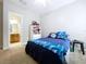 This bedroom features carpet, a ceiling fan, and a view of the bathroom at 3544 Brook Crossing Dr, Brandon, FL 33511