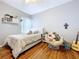 This bedroom features hardwood floors, a ceiling fan, and bright window at 3544 Brook Crossing Dr, Brandon, FL 33511