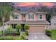Charming two-story home with manicured landscaping, shutters, and a two-car garage at 3544 Brook Crossing Dr, Brandon, FL 33511