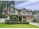 Charming two-story home with a well-manicured lawn and verdant landscaping at 3544 Brook Crossing Dr, Brandon, FL 33511