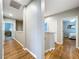 Spacious hallway with wood floors leading to various rooms at 3544 Brook Crossing Dr, Brandon, FL 33511
