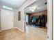View of office with two desks, chairs, and built in shelving inside of home near front entrance at 3544 Brook Crossing Dr, Brandon, FL 33511