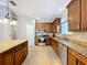 Open kitchen features stainless steel appliances, granite countertops and island at 3544 Brook Crossing Dr, Brandon, FL 33511