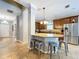 Well-lit kitchen with stainless steel appliances, granite counters, and a seating island at 3544 Brook Crossing Dr, Brandon, FL 33511