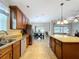 Bright kitchen with granite countertops, stainless steel appliances and an open layout to the living area at 3544 Brook Crossing Dr, Brandon, FL 33511