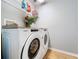 Laundry room with a washer and dryer, laminate countertops, and overhead wire shelving at 3544 Brook Crossing Dr, Brandon, FL 33511