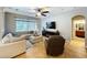 Bright and airy living room featuring neutral tones, a ceiling fan and recessed lighting at 3544 Brook Crossing Dr, Brandon, FL 33511