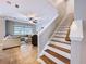 Cozy living room with a ceiling fan and view of the staircase at 3544 Brook Crossing Dr, Brandon, FL 33511