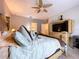 The spacious main bedroom features a ceiling fan and a media center at 3544 Brook Crossing Dr, Brandon, FL 33511