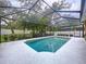 Enjoy the privacy of this sparkling pool inside screened enclosure, enhanced by lush landscaping at 3544 Brook Crossing Dr, Brandon, FL 33511