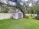 Convenient backyard storage shed provides ample space for tools and equipment, set against a privacy fence at 3544 Brook Crossing Dr, Brandon, FL 33511