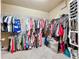 Walk-in closet with extensive shelving and hanging racks, providing ample storage space for clothing at 3544 Brook Crossing Dr, Brandon, FL 33511