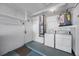 Basement featuring a washer, dryer, water heater, and utility closet at 3705 Simpson Ct, Palm Harbor, FL 34684
