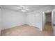 Bright bedroom with clean white walls, light floors, closet and ample natural light at 3705 Simpson Ct, Palm Harbor, FL 34684