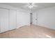 Clean, light-filled bedroom featuring light wood floors and double closets, perfect for restful nights at 3705 Simpson Ct, Palm Harbor, FL 34684