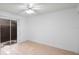 Bright bedroom with a fan and a sliding glass door leading to the outdoor space at 3705 Simpson Ct, Palm Harbor, FL 34684