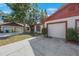 Charming home with a one-car garage and well-maintained landscaping at 3705 Simpson Ct, Palm Harbor, FL 34684