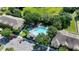 Aerial view of the community pool and surrounding buildings at 37712 Aaralyn Rd, Zephyrhills, FL 33542