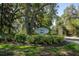 Eiland Park Townhomes entrance sign surrounded by lush landscaping at 37712 Aaralyn Rd, Zephyrhills, FL 33542