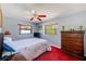 Cozy bedroom featuring a comfortable bed and a classic wooden dresser at 4360 82Nd N Ave, Pinellas Park, FL 33781