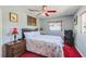 Comfortable bedroom with a large bed, ceiling fan, and two bedside tables at 4360 82Nd N Ave, Pinellas Park, FL 33781