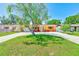Inviting single-story home featuring a well-kept lawn and a spacious driveway with ample parking at 4360 82Nd N Ave, Pinellas Park, FL 33781