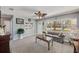 Bright and airy living room with a view to front yard features neutral walls and comfortable seating at 4360 82Nd N Ave, Pinellas Park, FL 33781