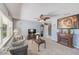 Inviting living room boasts a fireplace, large window, and a view to the kitchen with neutral colors at 4360 82Nd N Ave, Pinellas Park, FL 33781