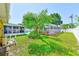 An enclosed pool and lush yard offer privacy for relaxation and recreation at 4360 82Nd N Ave, Pinellas Park, FL 33781