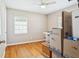 Bedroom with hardwood floors, a ceiling fan, and lots of natural light at 4512 S Lois Ave, Tampa, FL 33611
