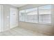 Light filled entryway with a white front door and large window at 4512 S Lois Ave, Tampa, FL 33611