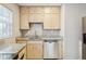 Updated kitchen featuring granite countertops, stainless steel appliances, and ample storage at 4512 S Lois Ave, Tampa, FL 33611