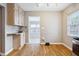 Bright eat-in kitchen featuring hardwood floors and stainless steel appliances at 4512 S Lois Ave, Tampa, FL 33611