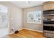 Bright eat-in kitchen featuring hardwood floors and stainless steel appliances at 4512 S Lois Ave, Tampa, FL 33611