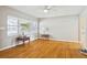 Bright living room featuring hardwood floors, a large window, and neutral walls at 4512 S Lois Ave, Tampa, FL 33611