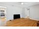 Bright and spacious living room with hardwood floors and an open floorplan at 4512 S Lois Ave, Tampa, FL 33611