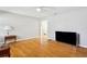 Spacious living room features sleek hardwood flooring and bright, neutral paint at 4512 S Lois Ave, Tampa, FL 33611