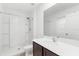Bright bathroom featuring a sleek vanity and shower at 4831 Hillman Ter, North Port, FL 34288